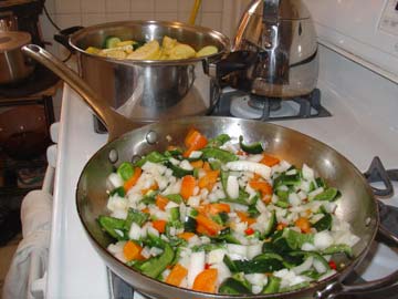 I used a mix of orange peppers, poblano peppers and threw in a red cayenne pepper as well.  See that Dutch oven in the background?  I had to move it all into my big stock pot.