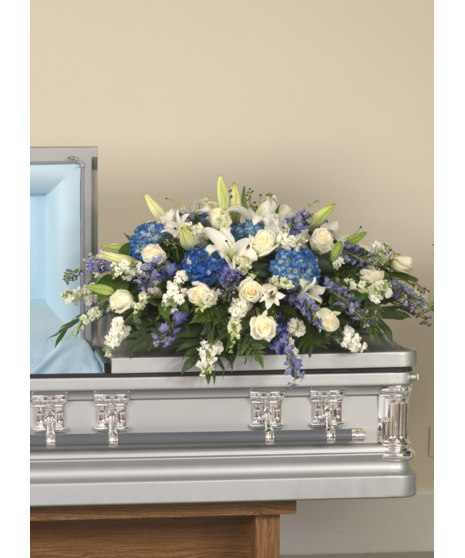 blue and white casket spray