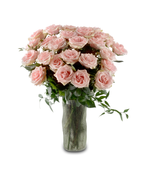 Blush pink roses arranged in a glass vase with greenery and optional baby's breath, forming a full romantic bouquet available in multiple rose counts.