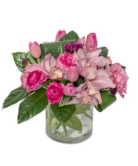 Opulent arrangement with fragrant roses, charming ranunculus, and sophisticated cymbidium orchids—a celebration of refined tastes and enduring affection