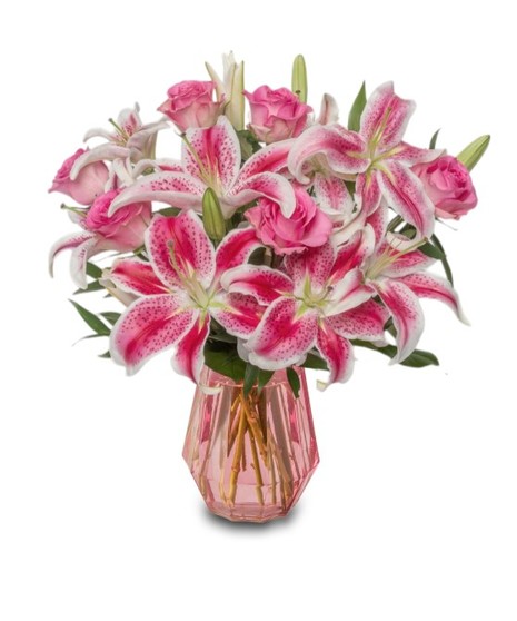 Pink Starfighter lilies arranged in a modern pink glass vase, with optional pink roses in deluxe, premium and exquisite sizes