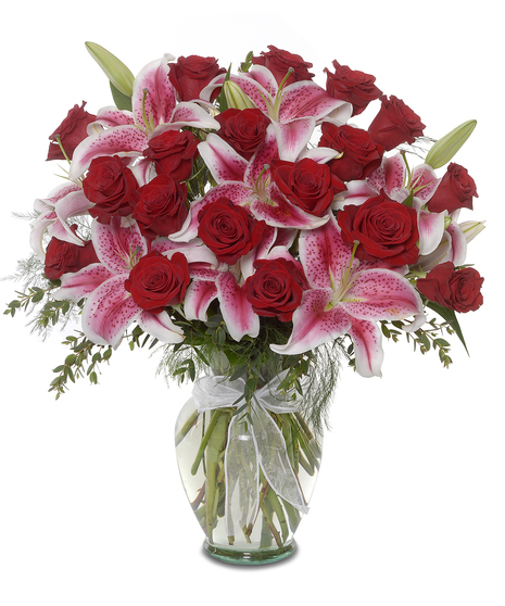 arrangement of roses and stargazer lilies