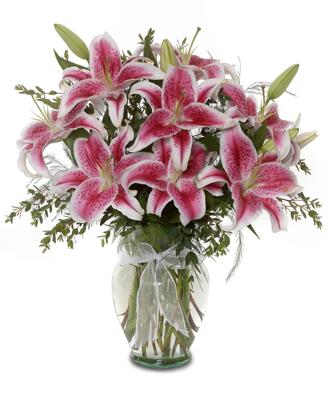 arrangement of roses and stargazer lilies