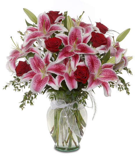 arrangement of roses and stargazer lilies