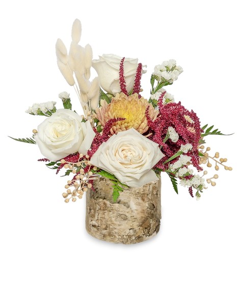 Elegant arrangement in rustic wooden cylinder: ivory roses, peach mums, bleach bunny wheat, and deep burgundy hues. An embodiment of serene autumn beauty.