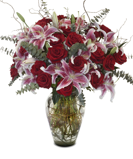 arrangement of roses and stargazer lilies