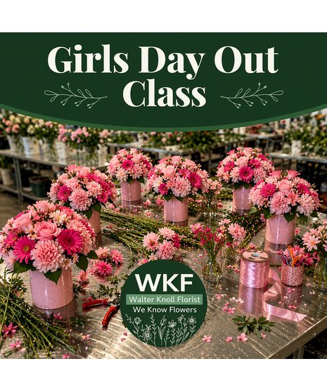 Girl Day Out floral design class with pink flower arrangements on a steel design table in a flower shop workshop